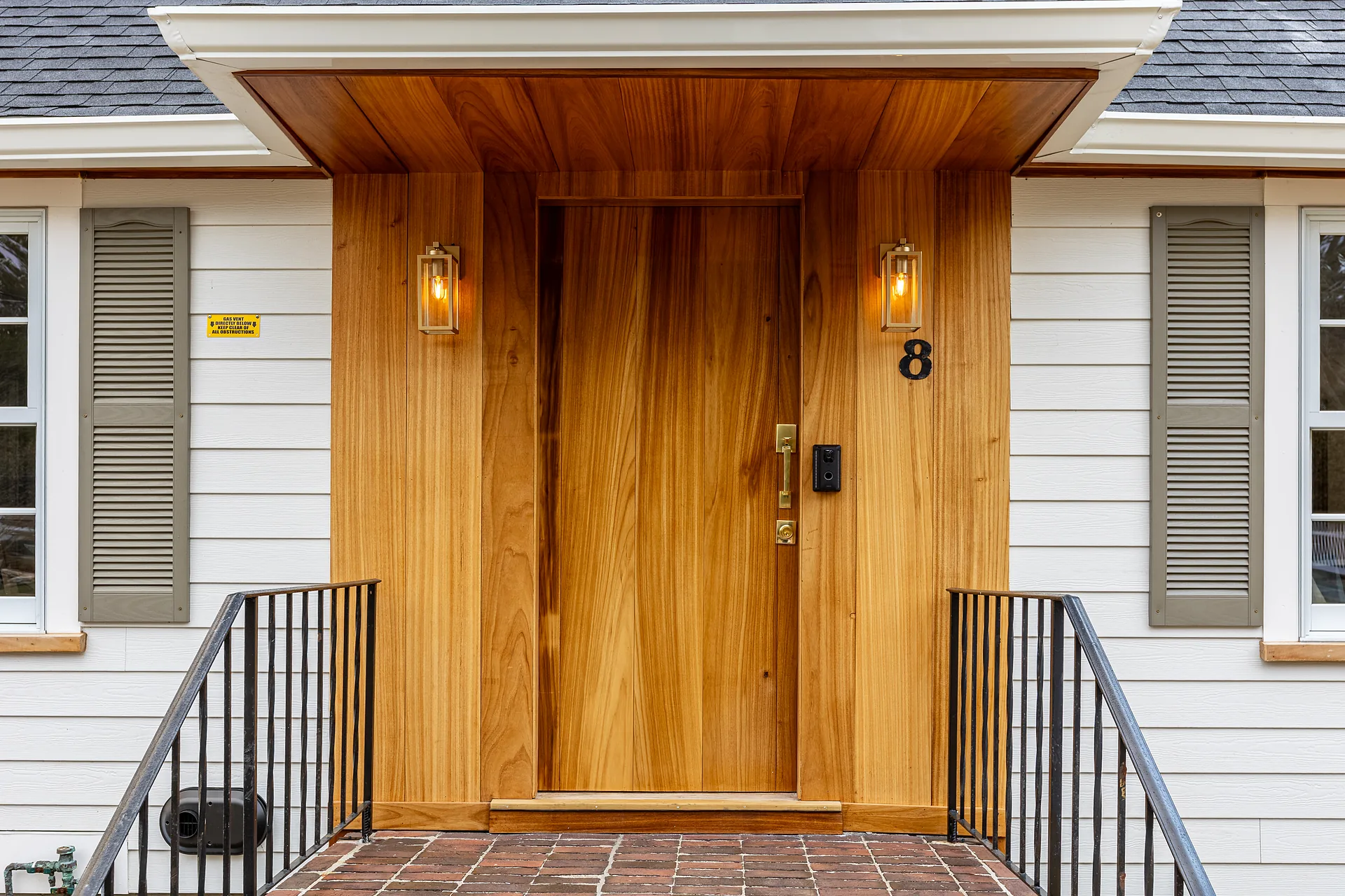 Custom exterior wood entry door installation by Prospera Home Solutions in Utah